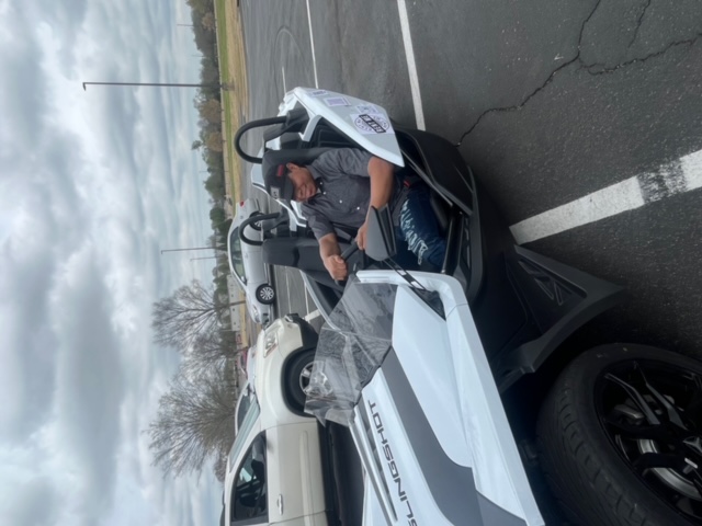 A man parked in the Slingshot